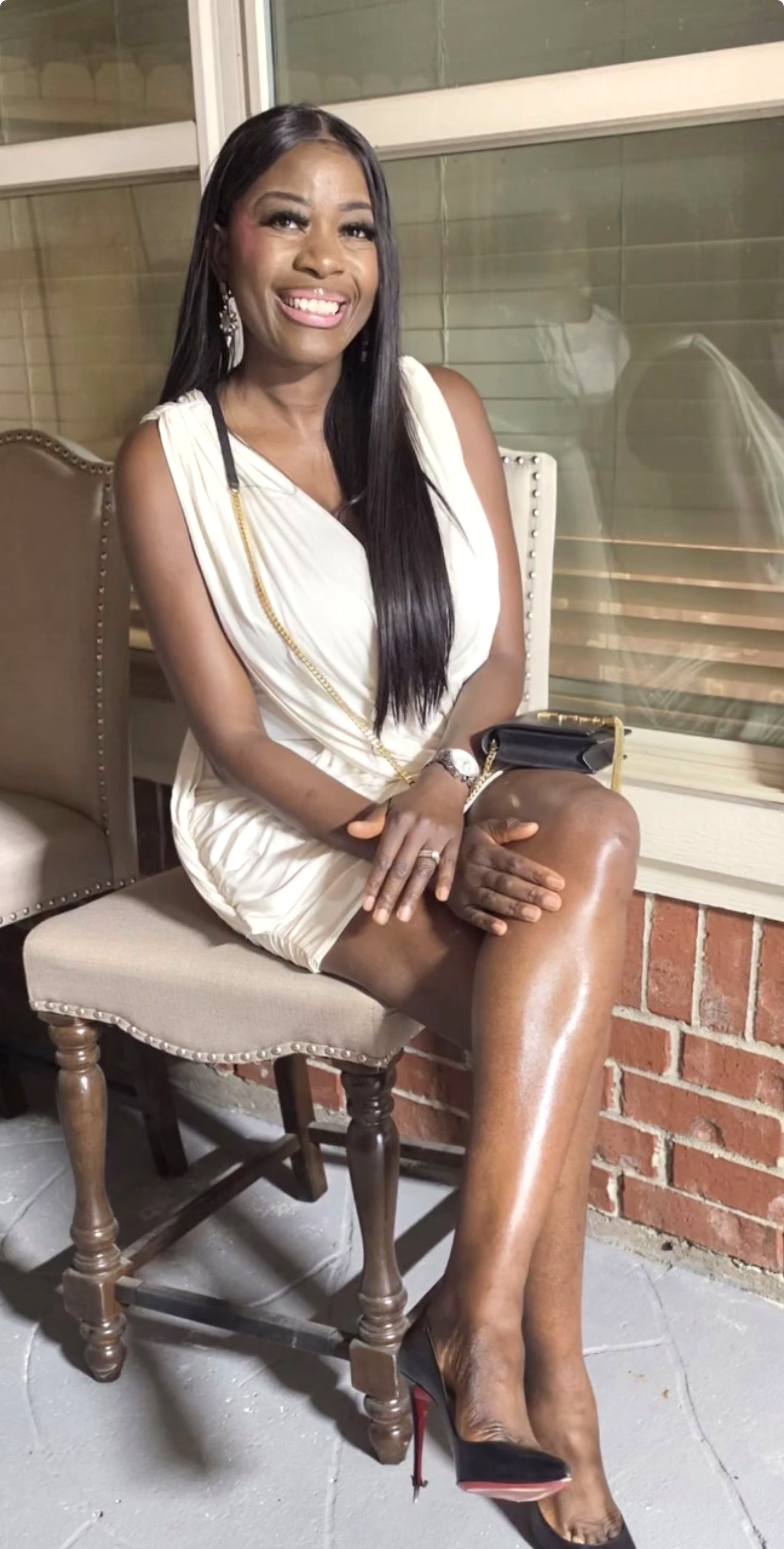 Gwen Keri smiling in a white dress